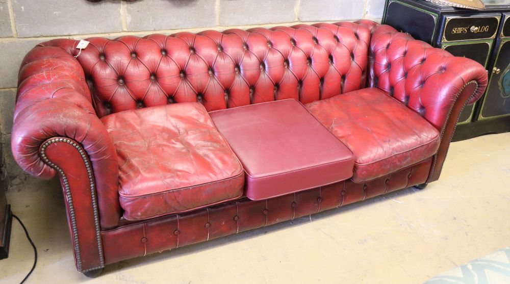 A buttoned red leather Chesterfield settee, W.200cm, D.84cm, H.66cm